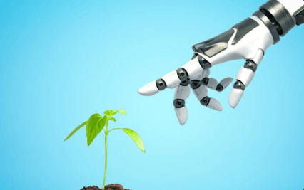 robot hand touching a plant seedling