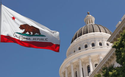 california state flag and capitol building