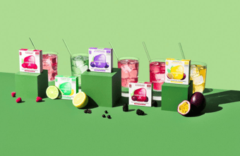 waterdrop® boxes, multicolor drinks with straws, and different fruits